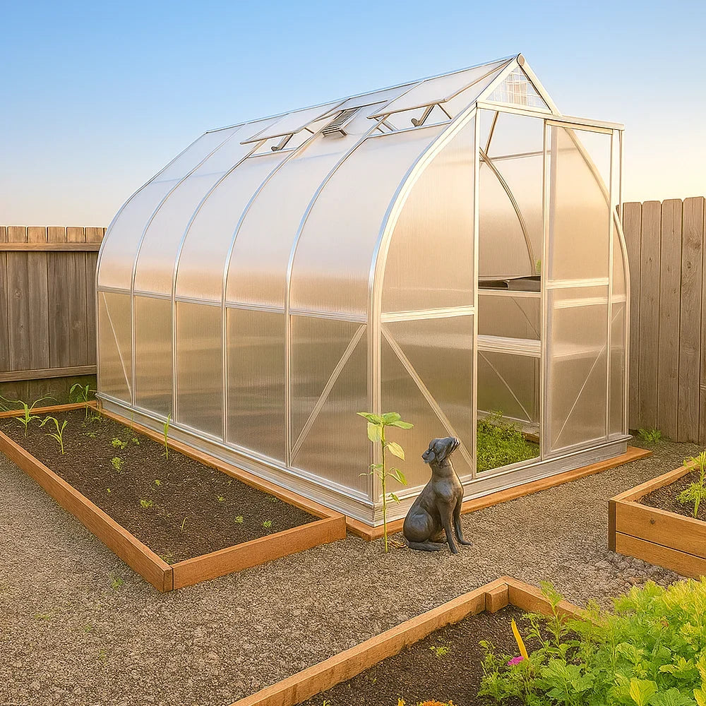 7x12 greenhouse ClimaPod Spirit with dog sculpture in a vegetable garden