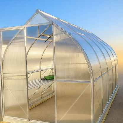 polycarbonate greenhouse with a clear roof and curved walls against a blue sky.