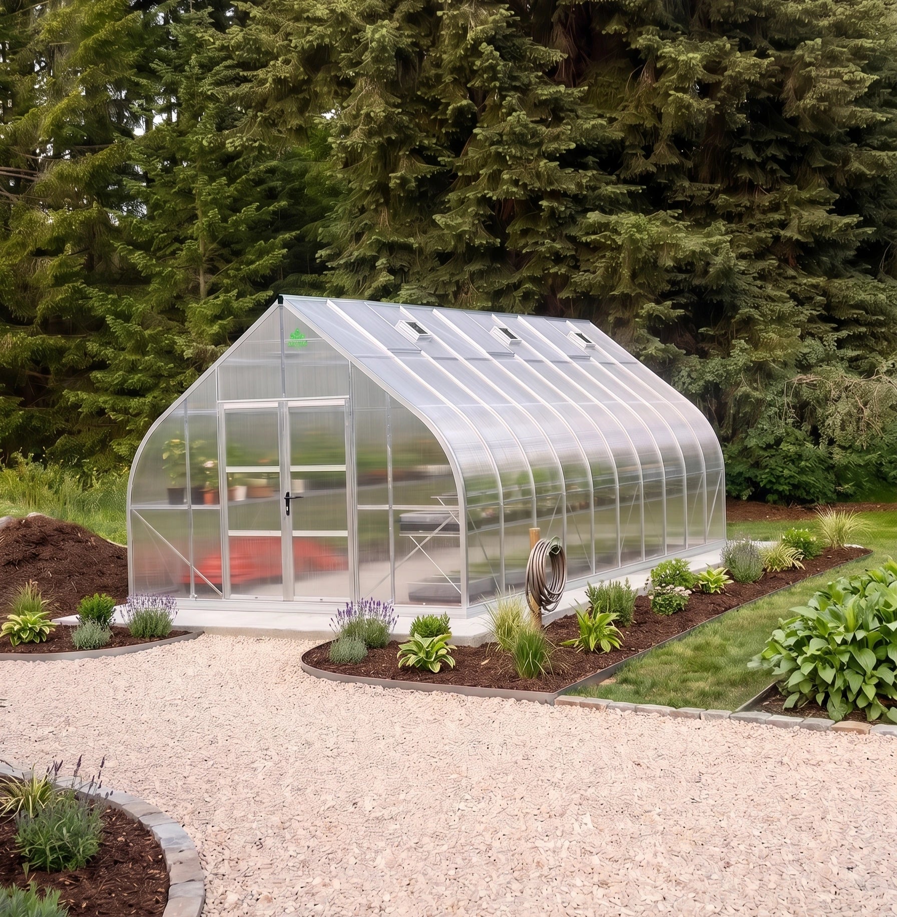 Clear greenhouse in a garden setting with trees in the background